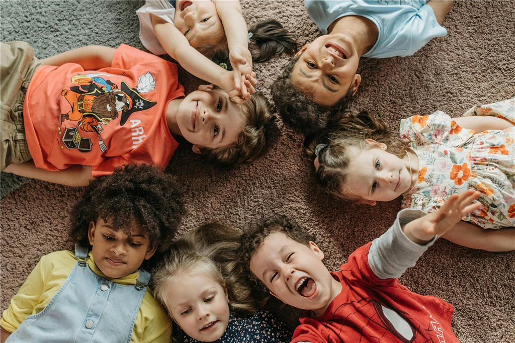 Children laying on mat