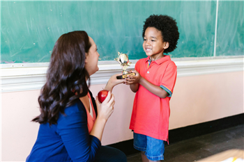 Child handing Award