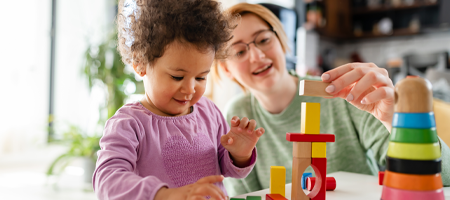 image of mum and toddler playing witt building blocks